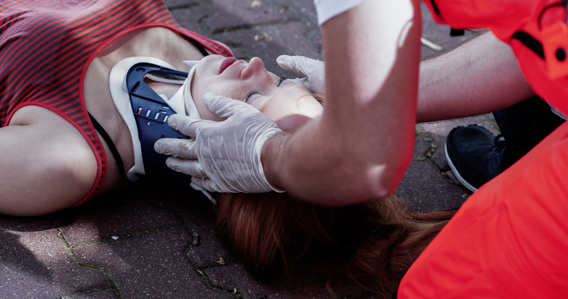 Close-up of a paramedic helping a car accident victim